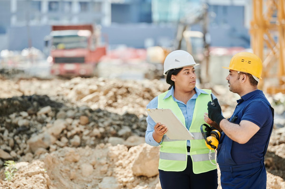 Site managers coordinating outsourced project